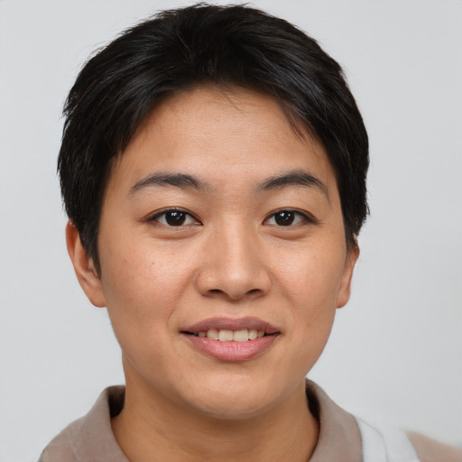 Joyful asian young-adult female with short  brown hair and brown eyes