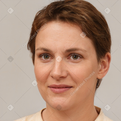 Joyful white adult female with short  brown hair and brown eyes