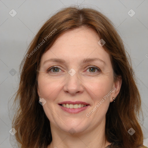 Joyful white adult female with medium  brown hair and grey eyes