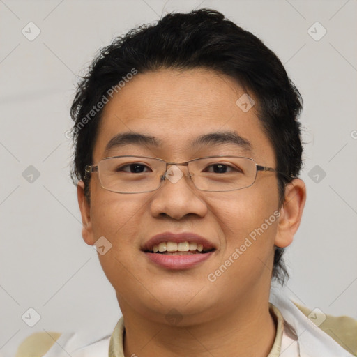 Joyful asian young-adult male with short  brown hair and brown eyes