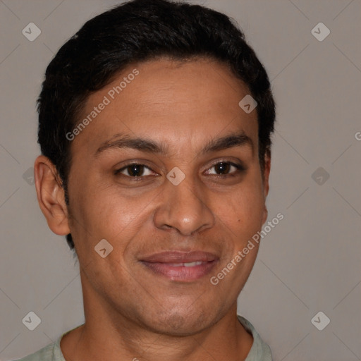 Joyful latino adult male with short  brown hair and brown eyes