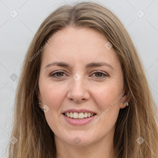 Joyful white young-adult female with long  brown hair and grey eyes