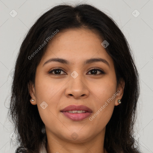 Joyful latino young-adult female with long  brown hair and brown eyes