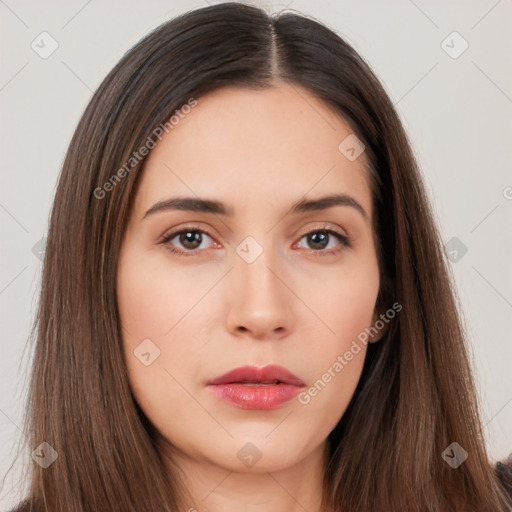 Neutral white young-adult female with long  brown hair and brown eyes