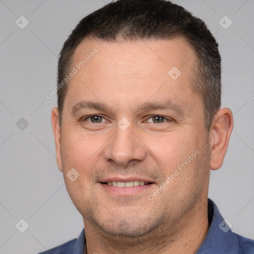 Joyful white adult male with short  brown hair and brown eyes