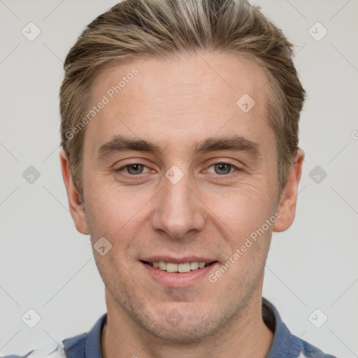 Joyful white adult male with short  brown hair and grey eyes