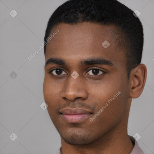 Joyful black young-adult male with short  black hair and brown eyes