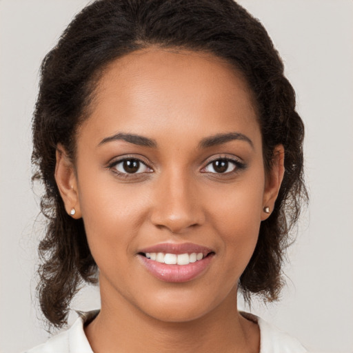 Joyful white young-adult female with medium  brown hair and brown eyes