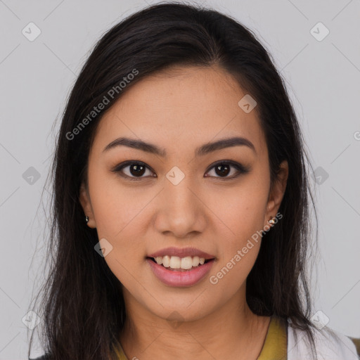 Joyful latino young-adult female with long  brown hair and brown eyes