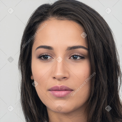 Joyful latino young-adult female with long  black hair and brown eyes