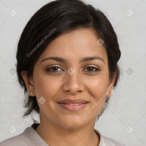 Joyful latino young-adult female with medium  brown hair and brown eyes