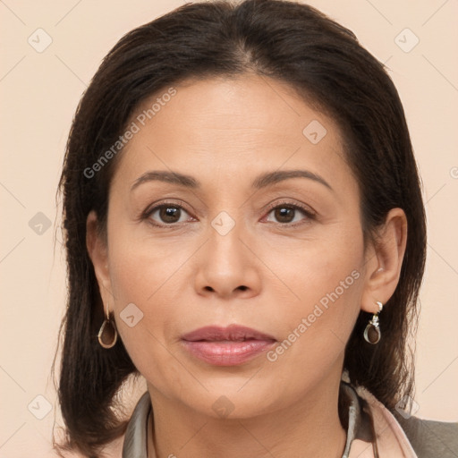 Joyful white adult female with medium  brown hair and brown eyes