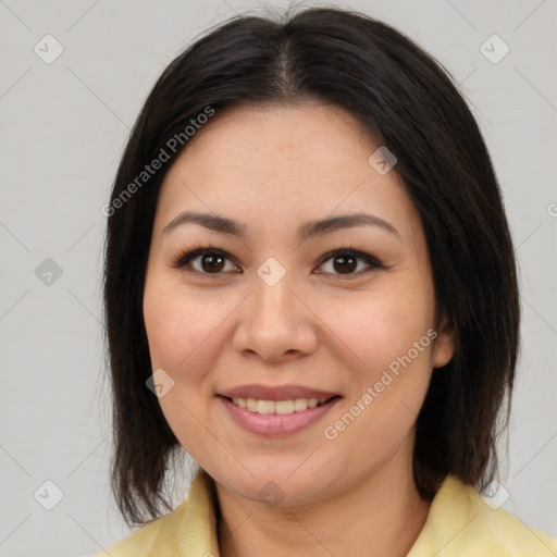 Joyful latino young-adult female with medium  brown hair and brown eyes