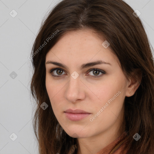 Neutral white young-adult female with long  brown hair and brown eyes