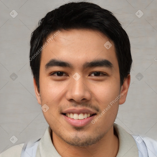 Joyful asian young-adult male with short  black hair and brown eyes