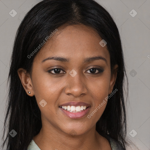 Joyful black young-adult female with long  brown hair and brown eyes