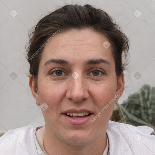 Joyful white adult female with short  brown hair and brown eyes