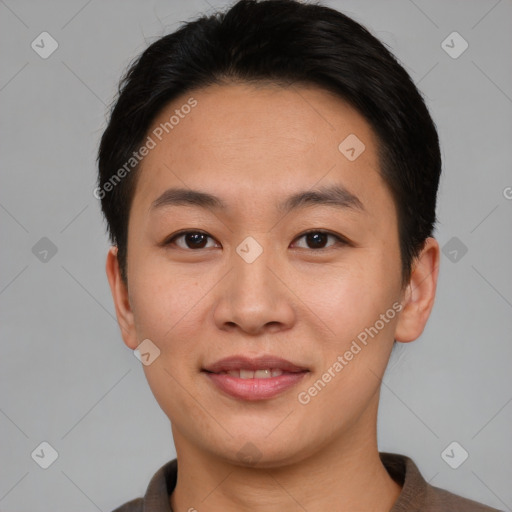 Joyful asian young-adult female with short  brown hair and brown eyes