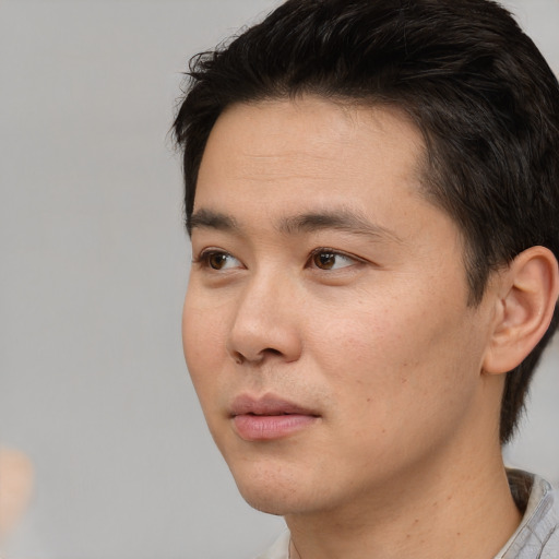 Neutral white young-adult male with short  black hair and brown eyes