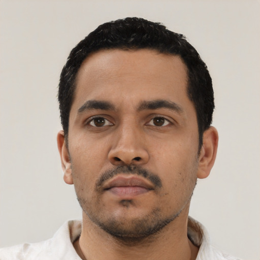 Neutral latino young-adult male with short  black hair and brown eyes