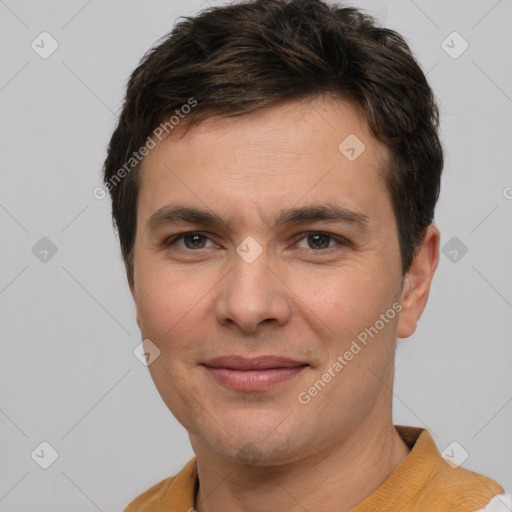 Joyful white young-adult male with short  brown hair and brown eyes