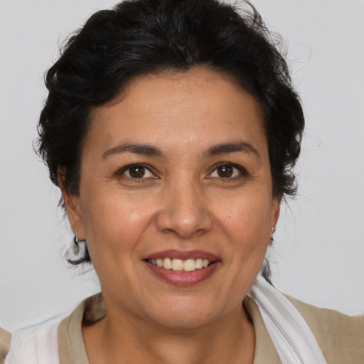Joyful white adult female with medium  brown hair and brown eyes
