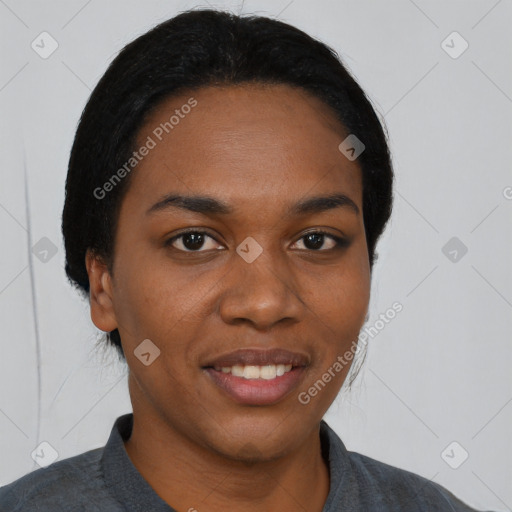 Joyful black young-adult female with short  black hair and brown eyes