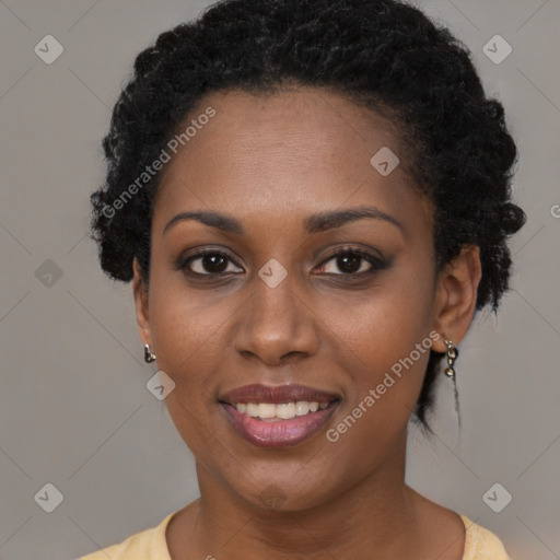 Joyful black young-adult female with short  black hair and brown eyes