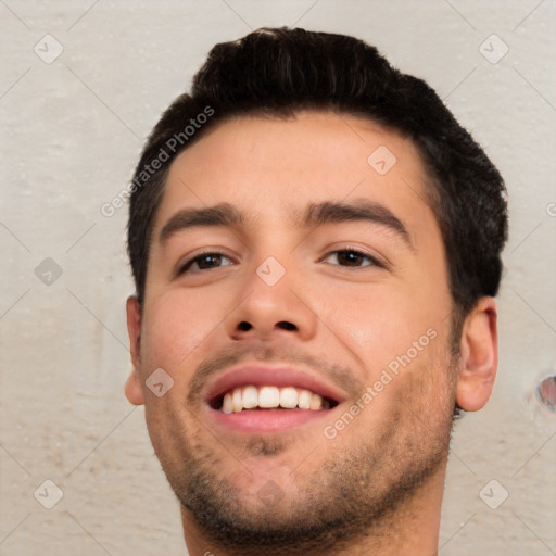 Joyful white young-adult male with short  black hair and brown eyes