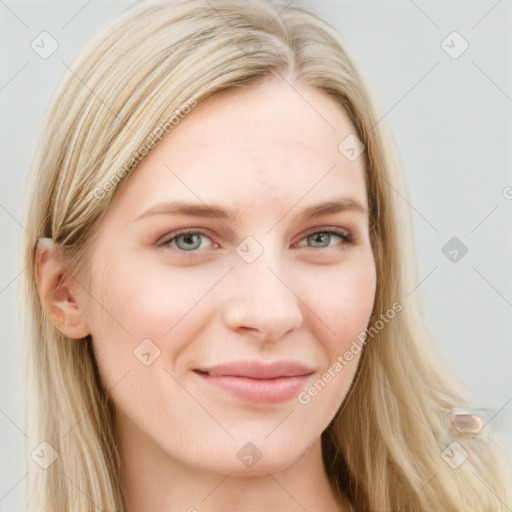 Joyful white young-adult female with long  brown hair and blue eyes