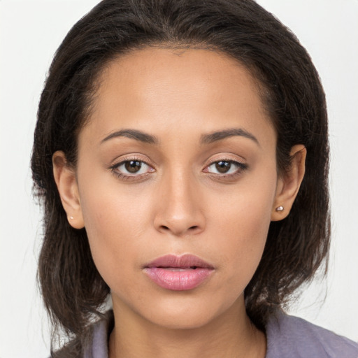 Neutral white young-adult female with long  brown hair and brown eyes