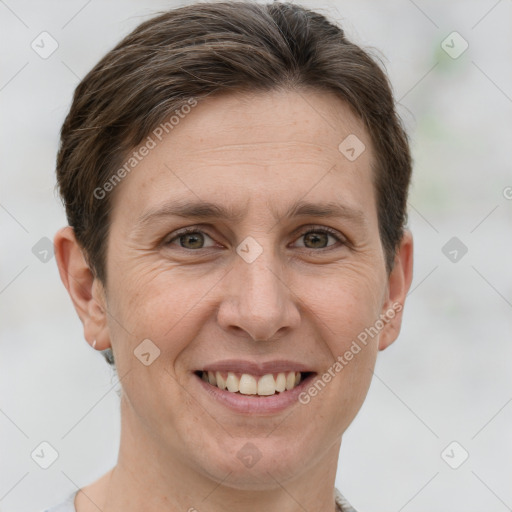 Joyful white adult female with short  brown hair and grey eyes