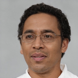 Neutral black adult male with short  black hair and brown eyes