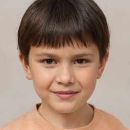 Joyful white child male with short  brown hair and brown eyes