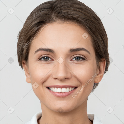 Joyful white young-adult female with short  brown hair and brown eyes