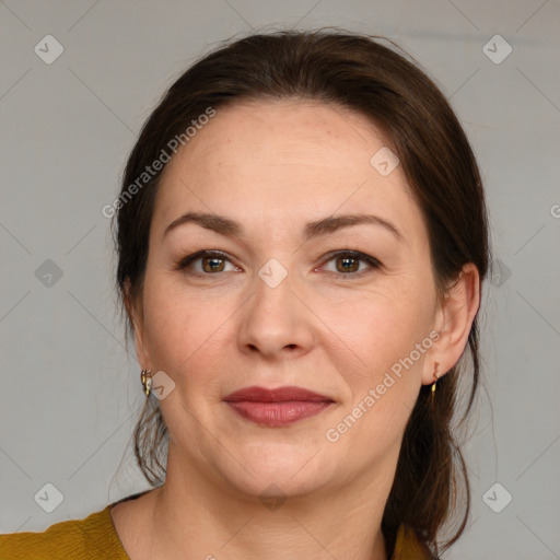 Joyful white adult female with medium  brown hair and brown eyes