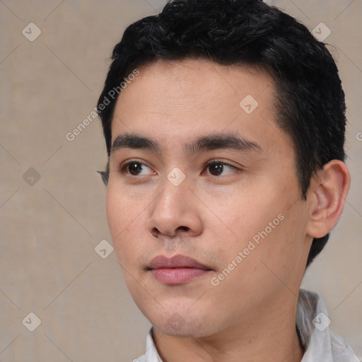 Neutral white young-adult male with short  black hair and brown eyes