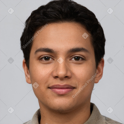 Joyful latino young-adult male with short  brown hair and brown eyes