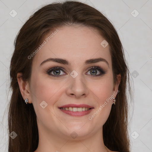 Joyful white young-adult female with long  brown hair and green eyes