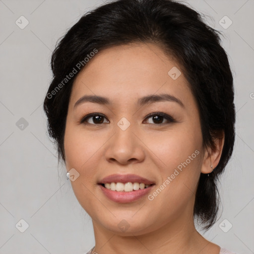 Joyful asian young-adult female with medium  brown hair and brown eyes