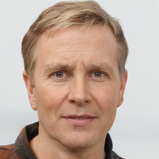 Joyful white middle-aged male with short  brown hair and grey eyes