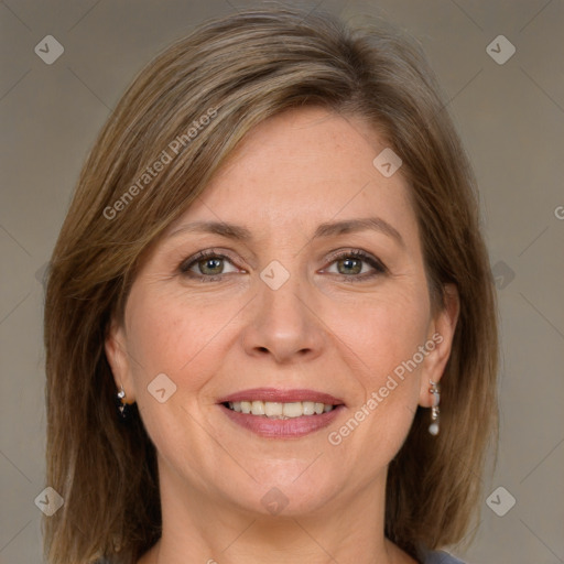 Joyful white adult female with medium  brown hair and grey eyes