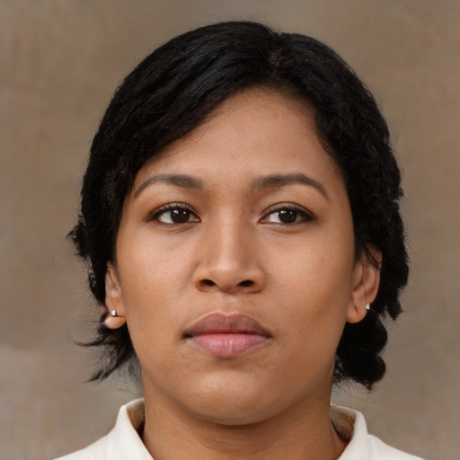 Neutral latino young-adult female with medium  brown hair and brown eyes