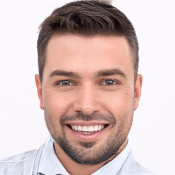 Joyful white young-adult male with short  brown hair and brown eyes