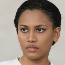 Neutral black young-adult female with short  brown hair and brown eyes