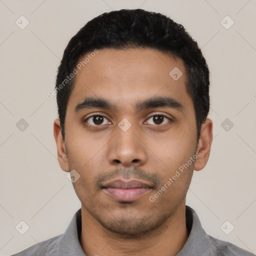 Neutral latino young-adult male with short  black hair and brown eyes