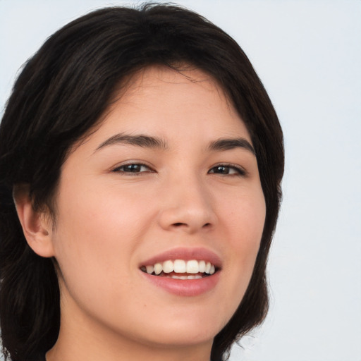 Joyful asian young-adult female with long  brown hair and brown eyes