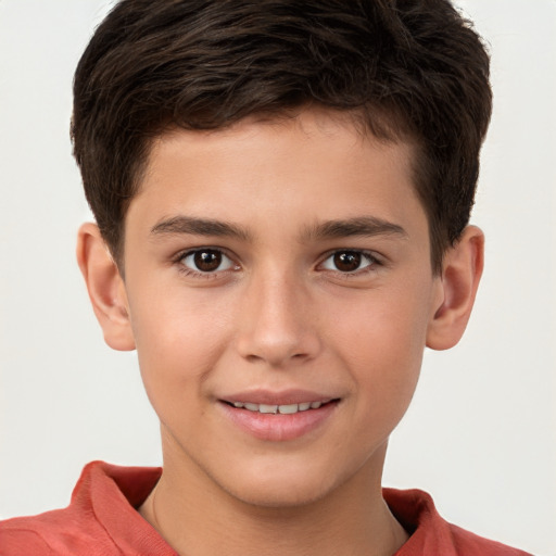 Joyful white child male with short  brown hair and brown eyes