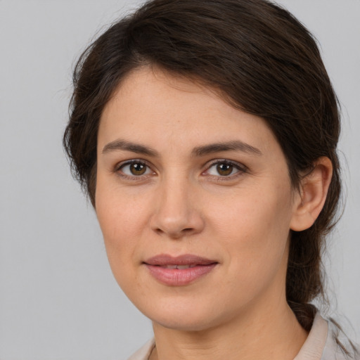 Joyful white young-adult female with medium  brown hair and brown eyes