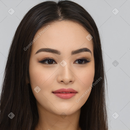 Joyful asian young-adult female with long  brown hair and brown eyes